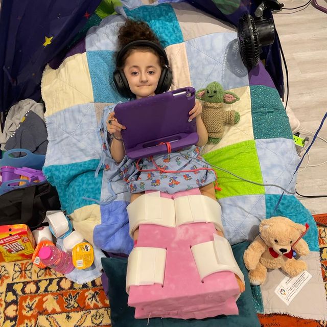 sammi wearing hospital dress playing ipad